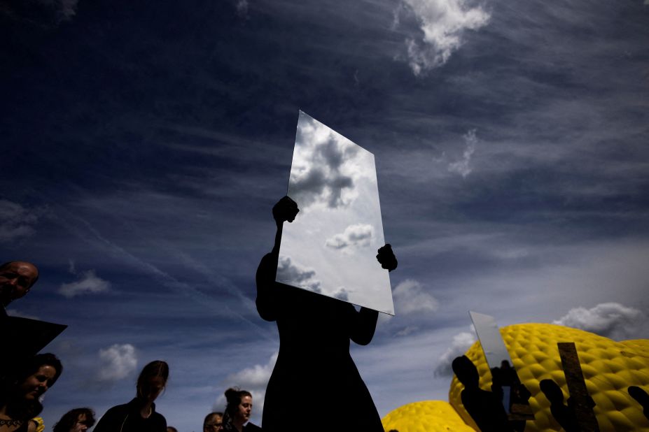 People perform during the Archstoyanie festival in Nikola-Lenivets, Russia, on Saturday July 29.