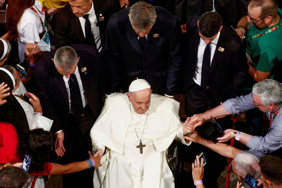 Pope Francis greets people as he leaves the Mosteiro dos Jeronimos after leading the Vespers with members of the clergy in Lisbon, Portugal, on Wednesday, August 2. Pope Francis made an apostolic journey to Portugal to mark World Youth Day.