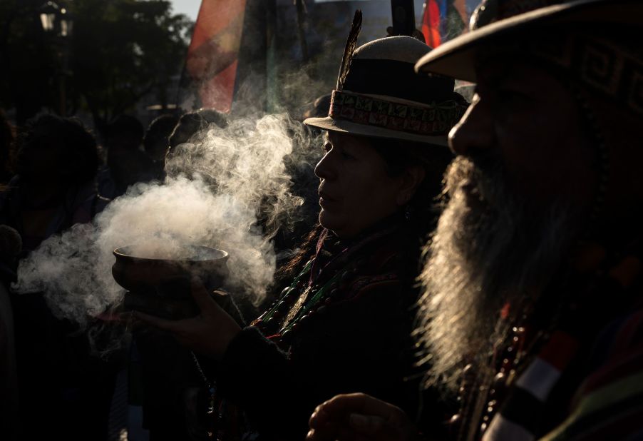 Indigenous leaders from the Argentina's Jujuy province burn incense during the celebrations of La Pachamama, or Mother Earth Day, in Buenos Aires on Tuesday, August 1. <a href=