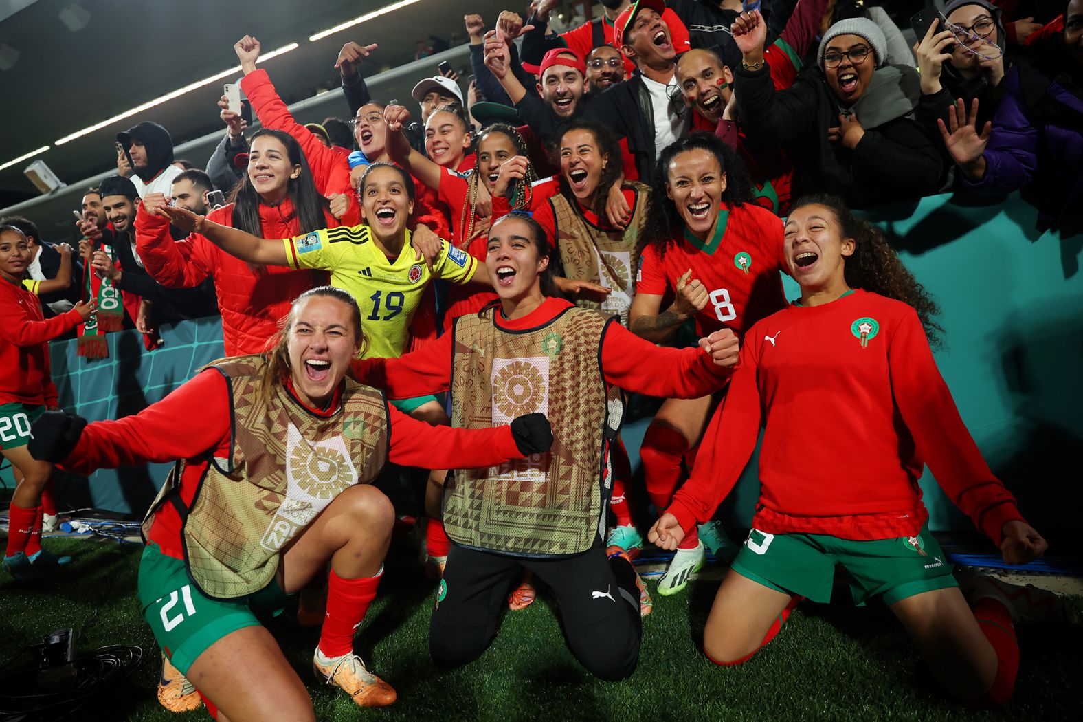 Morocco players celebrate on August 3 after beating Colombia 1-0 to advance to the round of 16.