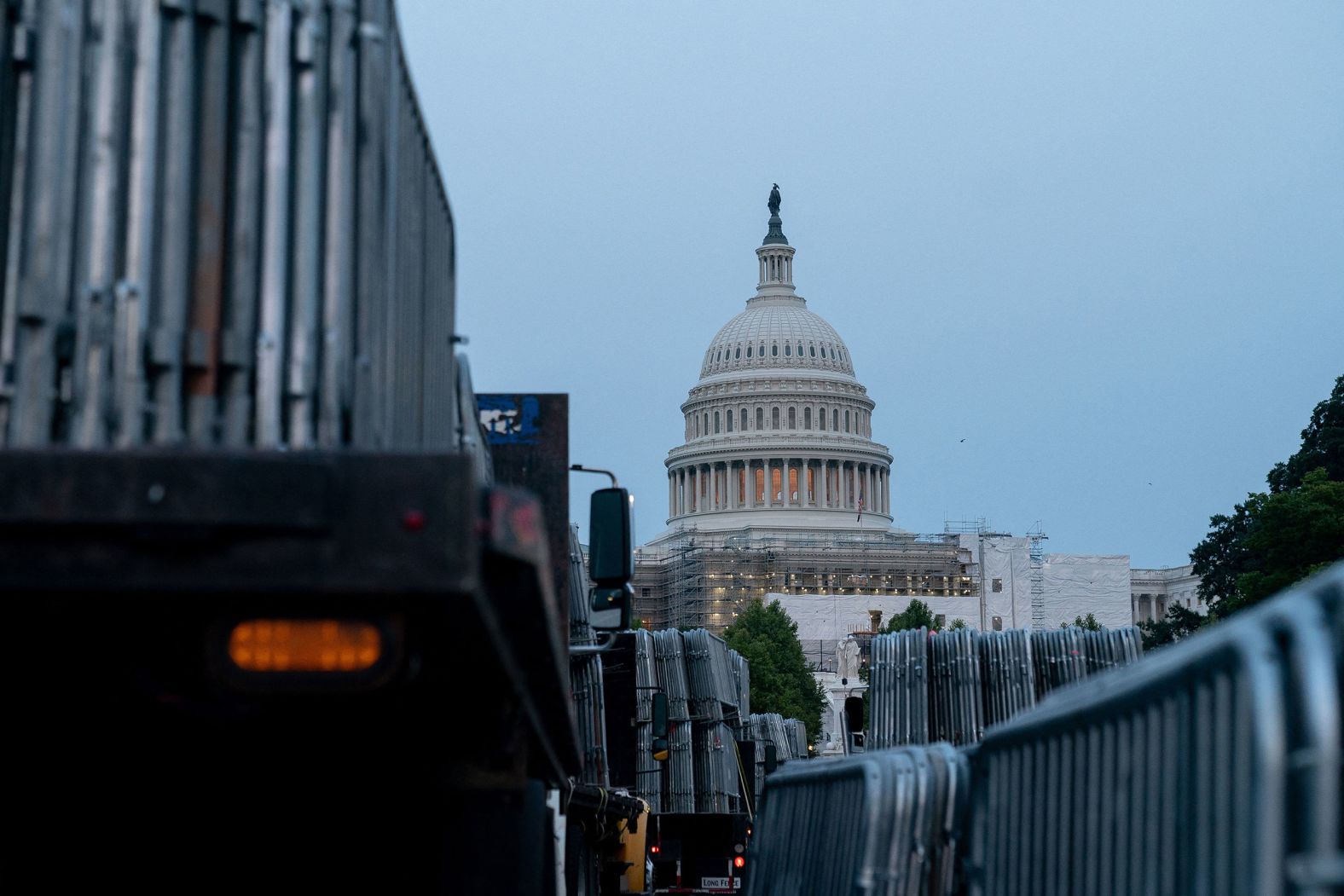 Workers set up security barricades outside the US Capitol on Wednesday.