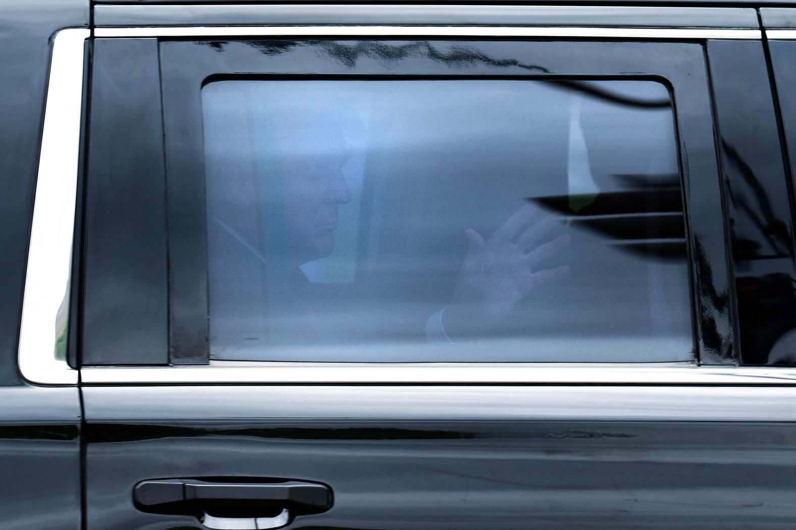 Trump waves from inside his SUV on his way to court in Washington, DC, on Thursday.