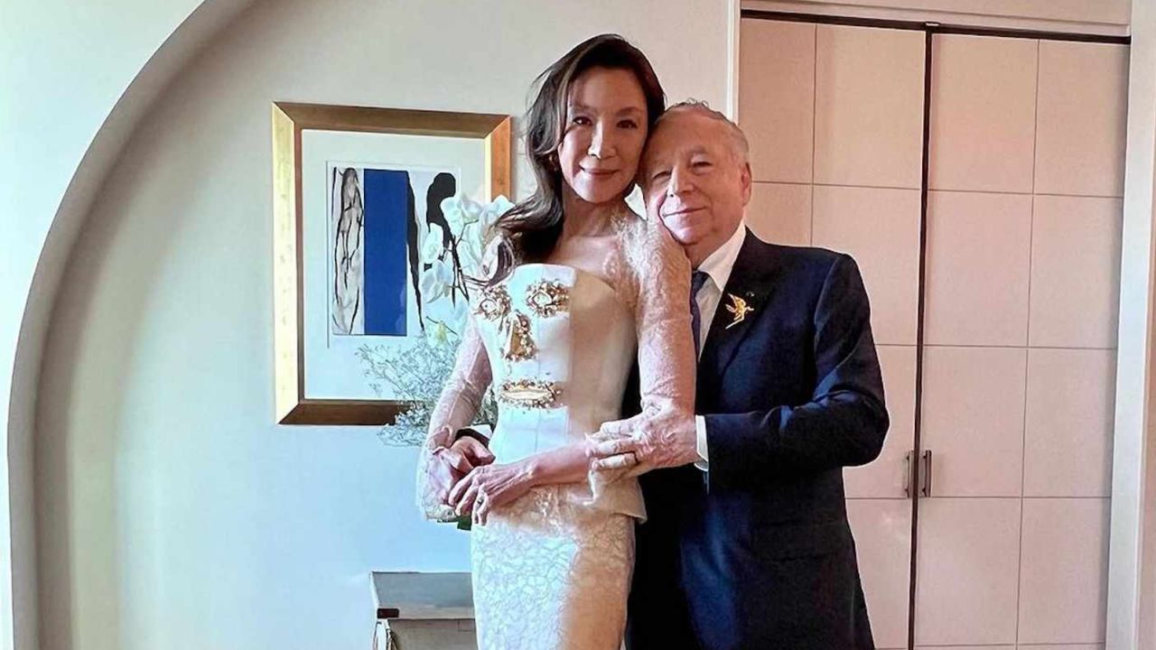 Michelle Yeoh wears a "face" bridal gown, designed by Schiaparelli.