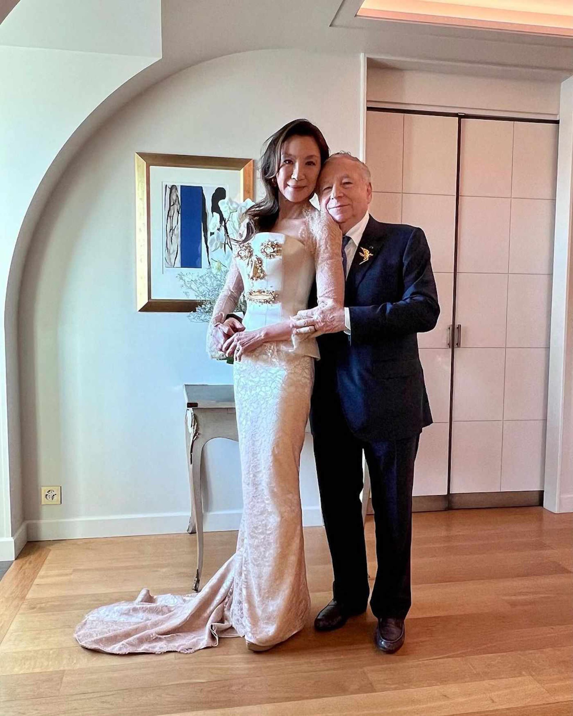 Michelle Yeoh wears a "face" bridal gown, designed by Schiaparelli.