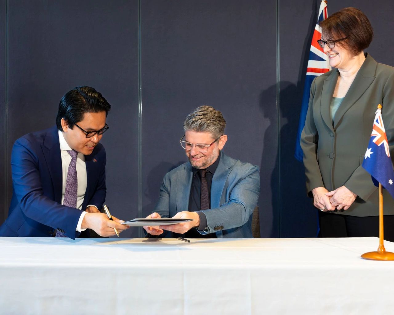 From left, Ambassador His Excellency Dr. Cheunboran Chanborey, Director Nick Mitzevich, and Susan Templeman MP pictured signing a loan agreement at the National Gallery of Australia in Canberra, Australia, 2023. Photo by: Karlee Holland.