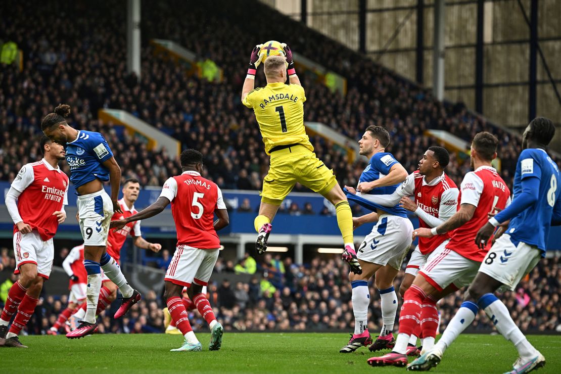 Arsenal's English goalkeeper Aaron Ramsdale jumps to catch the ball during the English Premier League football match between Everton and Arsenal at Goodison Park in Liverpool, north-west England, on February 4, 2023. - RESTRICTED TO EDITORIAL USE. No use with unauthorized audio, video, data, fixture lists, club/league logos or 'live' services. Online in-match use limited to 120 images. An additional 40 images may be used in extra time. No video emulation. Social media in-match use limited to 120 images. An additional 40 images may be used in extra time. No use in betting publications, games or single club/league/player publications. (Photo by Paul ELLIS / AFP) / RESTRICTED TO EDITORIAL USE. No use with unauthorized audio, video, data, fixture lists, club/league logos or 'live' services. Online in-match use limited to 120 images. An additional 40 images may be used in extra time. No video emulation. Social media in-match use limited to 120 images. An additional 40 images may be used in extra time. No use in betting publications, games or single club/league/player publications. / RESTRICTED TO EDITORIAL USE. No use with unauthorized audio, video, data, fixture lists, club/league logos or 'live' services. Online in-match use limited to 120 images. An additional 40 images may be used in extra time. No video emulation. Social media in-match use limited to 120 images. An additional 40 images may be used in extra time. No use in betting publications, games or single club/league/player publications. (Photo by PAUL ELLIS/AFP via Getty Images)