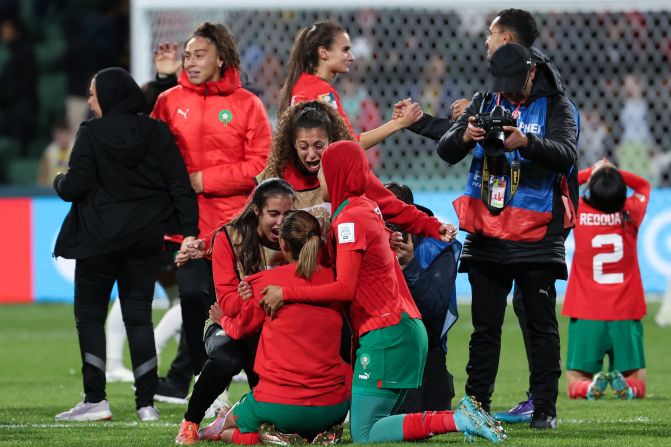 The Moroccan squad bundled around mobile phones before news of <a href="index.php?page=&url=https%3A%2F%2Fwww.cnn.com%2Fsport%2Flive-news%2Fgroup-stage-womens-world-cup-08-03-23%2Findex.html" target="_blank">Germany's 1-1 draw</a> filtered through, confirming a round of 16 clash with France and sparking tears of joy across the pitch. 