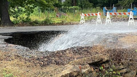 This photo posted to Twitter by the National Weather Service Birmingham on Friday, August 4, shows a collapsed road after flooding in Oneonta, Alabama. 