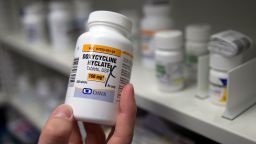 FILE - A pharmacist holds a bottle of the antibiotic doxycycline hyclate in Sacramento, Calif., July 8, 2016. On Tuesday, April 11, 2023, the Centers for Disease Control and Prevention released data about some of the most common infectious diseases in the U.S. The numbers show how chlamydia, gonorrhea and syphilis infections have been accelerating across the country. Meanwhile, the CDC is considering recommending the antibiotic doxycycline to be used after sex to prevent those infections. (AP Photo/Rich Pedroncelli, File)