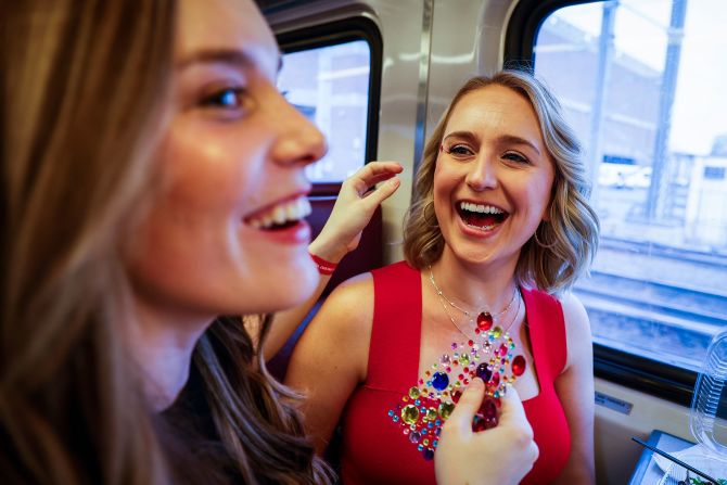 Fans apply jewels on their way to Swift's show in Foxborough, Massachusetts, in May 2023.