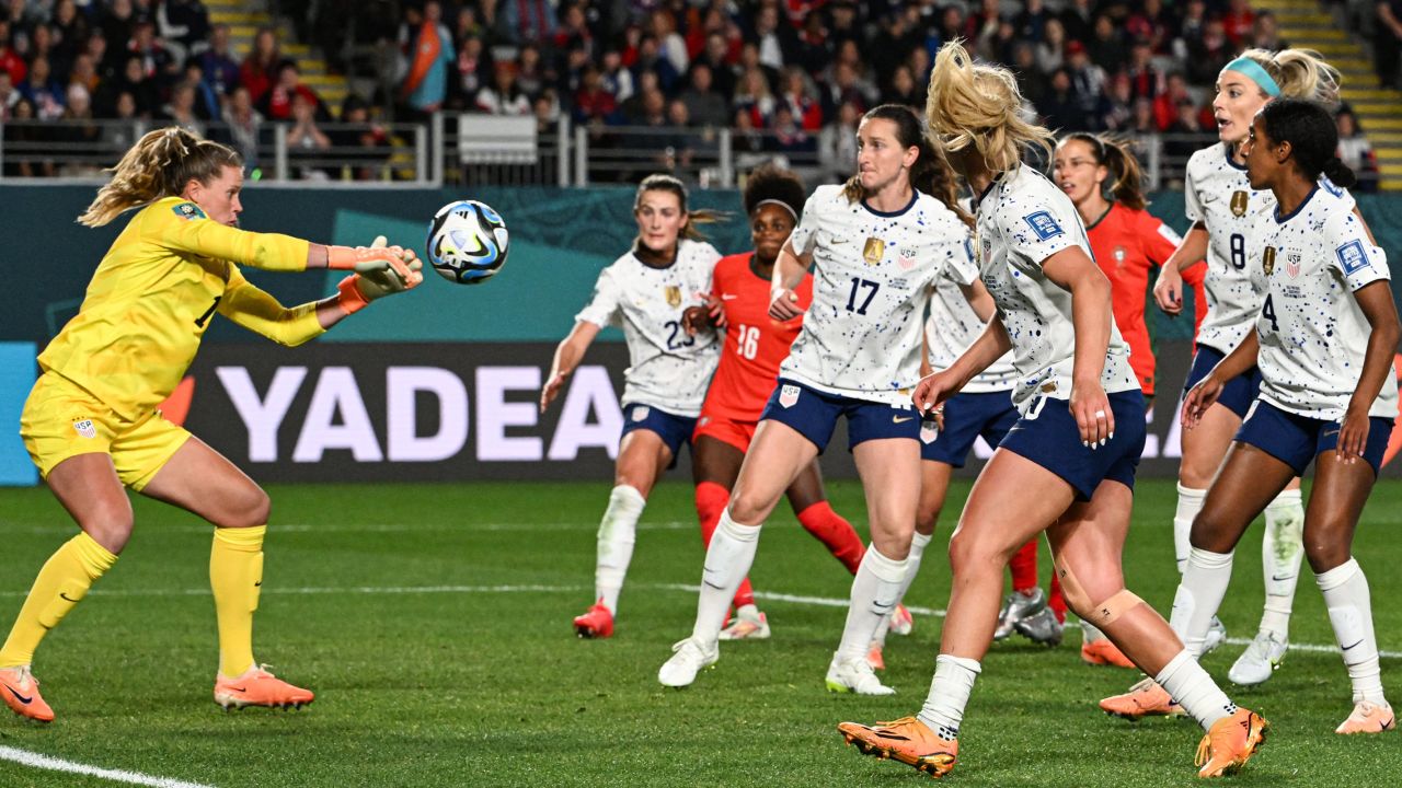 USA's goalkeeper Alyssa Naeher (L) makes a save during her team's draw against Portugal.