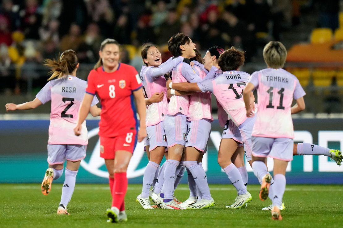 Japan's players celebrate after the opening goal against Norway.