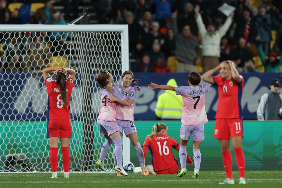 Japan's Risa Shimizu, third from left, celebrates with teammates after scoring in the 3-1 victory over Norway on August 5.
