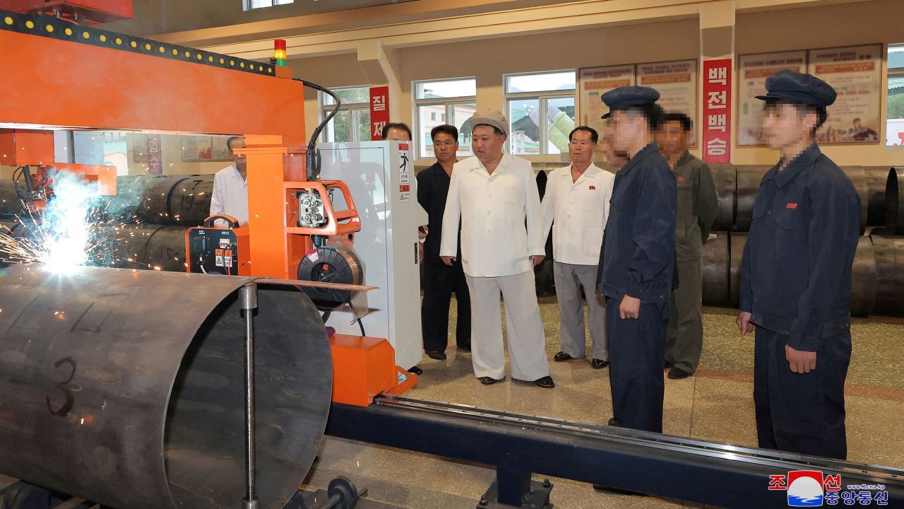 North Korean leader Kim Jong Un tours a weapons factory in this image released by North Korea's Korean Central News Agency on Sunday, August 6, 2023. Parts of this photo have been blurred by KCNA.