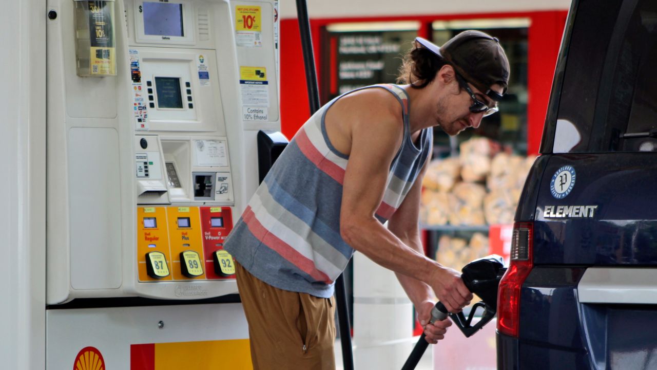 Oregon resident Patrick Coffin fills up his car with fuel at a gas station in Portland on Friday.