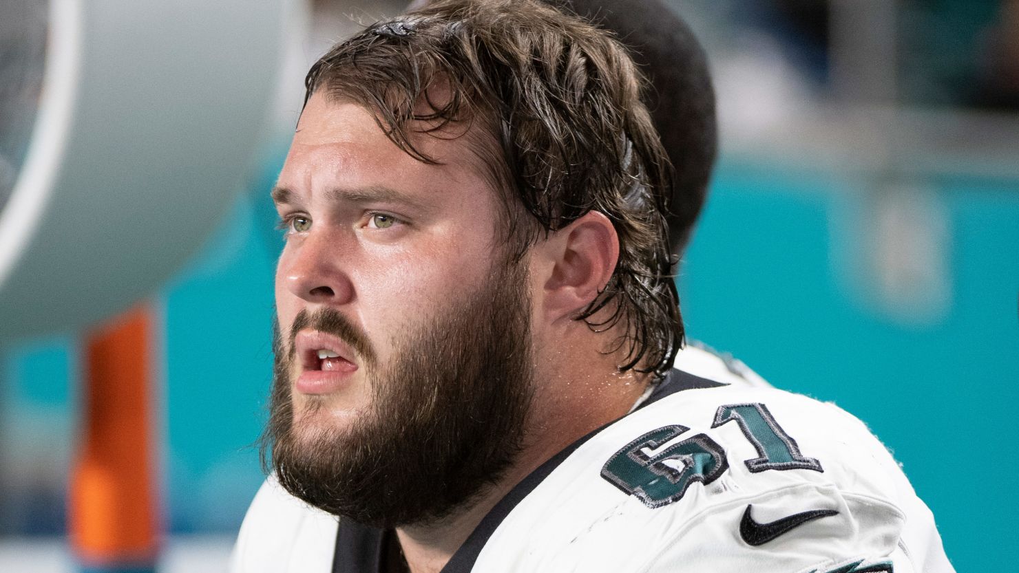 Philadelphia Eagles guard Josh Sills sits on the sidelines during a game on August 27, 2022, in Miami Gardens, Florida.