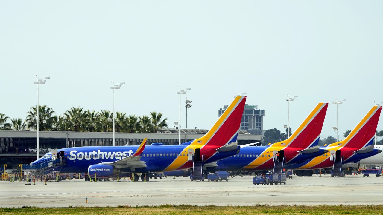 Southwest Airlines planes are seen parked at a terminal at Long Beach Airport, Tuesday, April 18, 2023, in Long Beach, California.