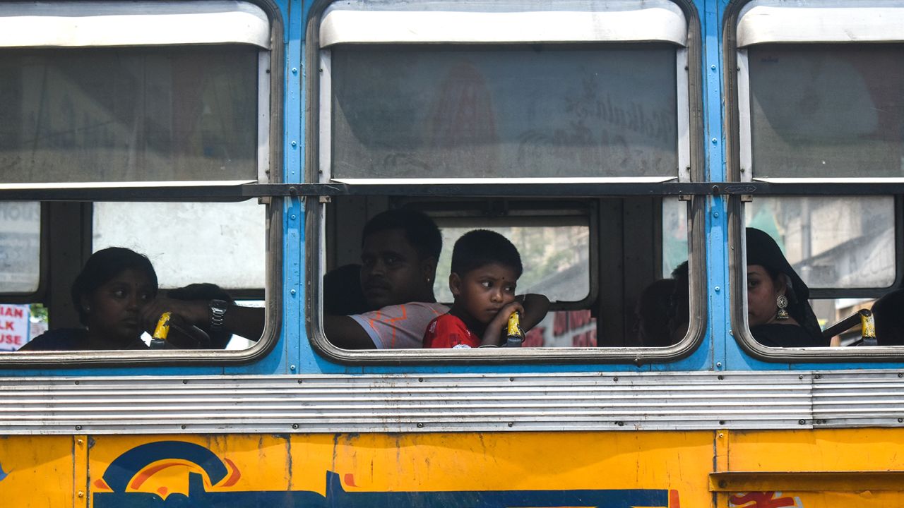 People travel on a bus on a hot and humid day in Kolkata, India on 11 June 2023. 