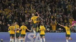 Australian players celebrate their opening goal during the Women's World Cup round of 16 soccer match between Australia and Denmark at Stadium Australia in Sydney, Australia, Monday, Aug. 7, 2023. (AP Photo/Rick Rycroft)