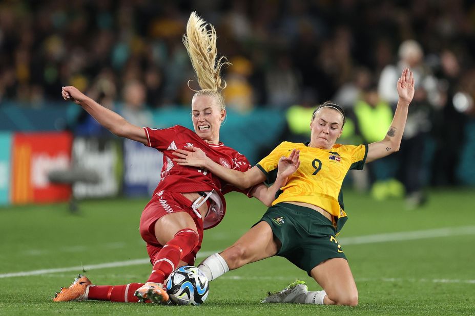 Denmark's Amalie Vangsgaard, left, and Australia's Caitlin Foord compete for the ball during a Women's World Cup match on Monday, August 7. <a href="https://edition.cnn.com/sport/live-news/england-nigeria-australia-denmark-womens-world-cup-knockout/h_96eb0aafc77d71f7b18c062bbe444f8a" target="_blank">Australia won 2-0</a> to advance to the quarterfinals.