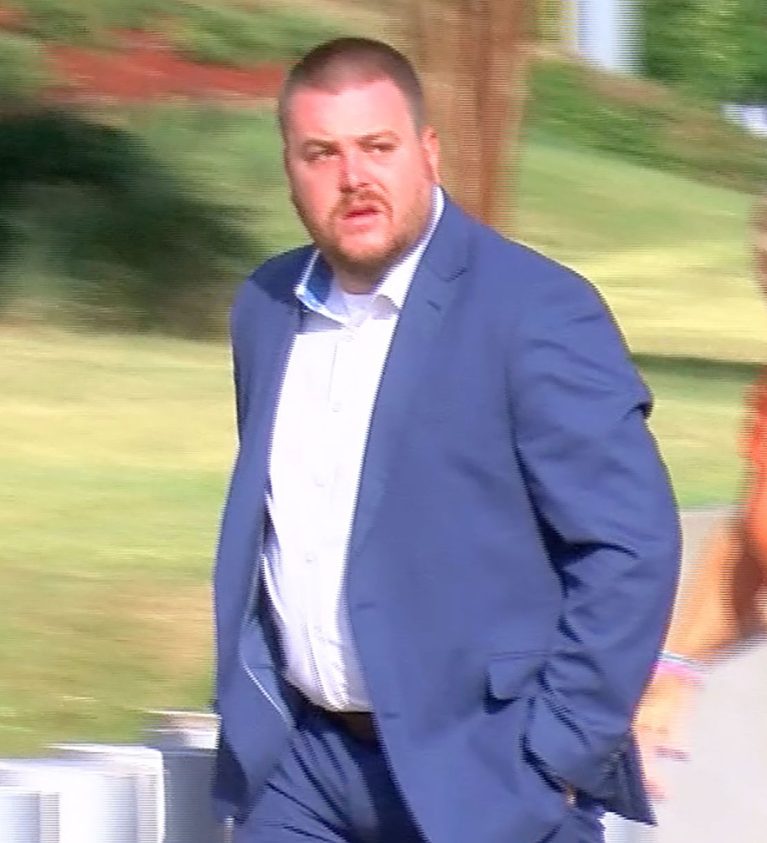 In this image taken from video, Christian Dedmon walks into the federal courthouse in Jackson.