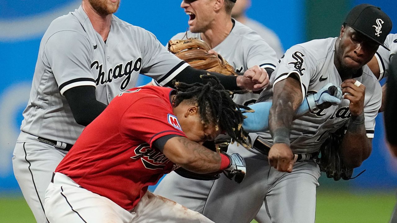 Chicago White Sox's Tim Anderson, right, punches Cleveland Guardians' Jose Ramírez, center, in the sixth inning of a baseball game Saturday.