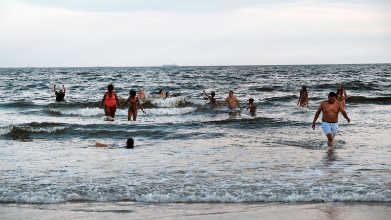NextImg:Woman hospitalized after apparent shark attack at New York City's Rockaway Beach | CNN