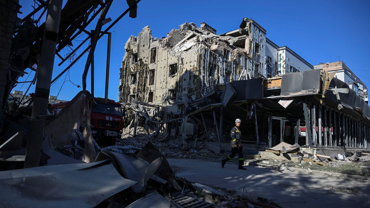 Rescuers work are seen on Tuesday at the site of a building destroyed during a Russian missile strike in the Donetsk region city of Pokrovsk.