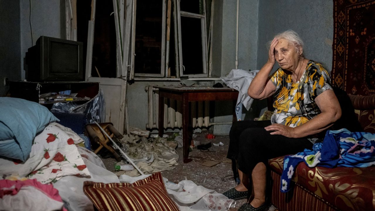 A wounded local resident is seen in her destroyed flat after the strikes in Pokrovsk.