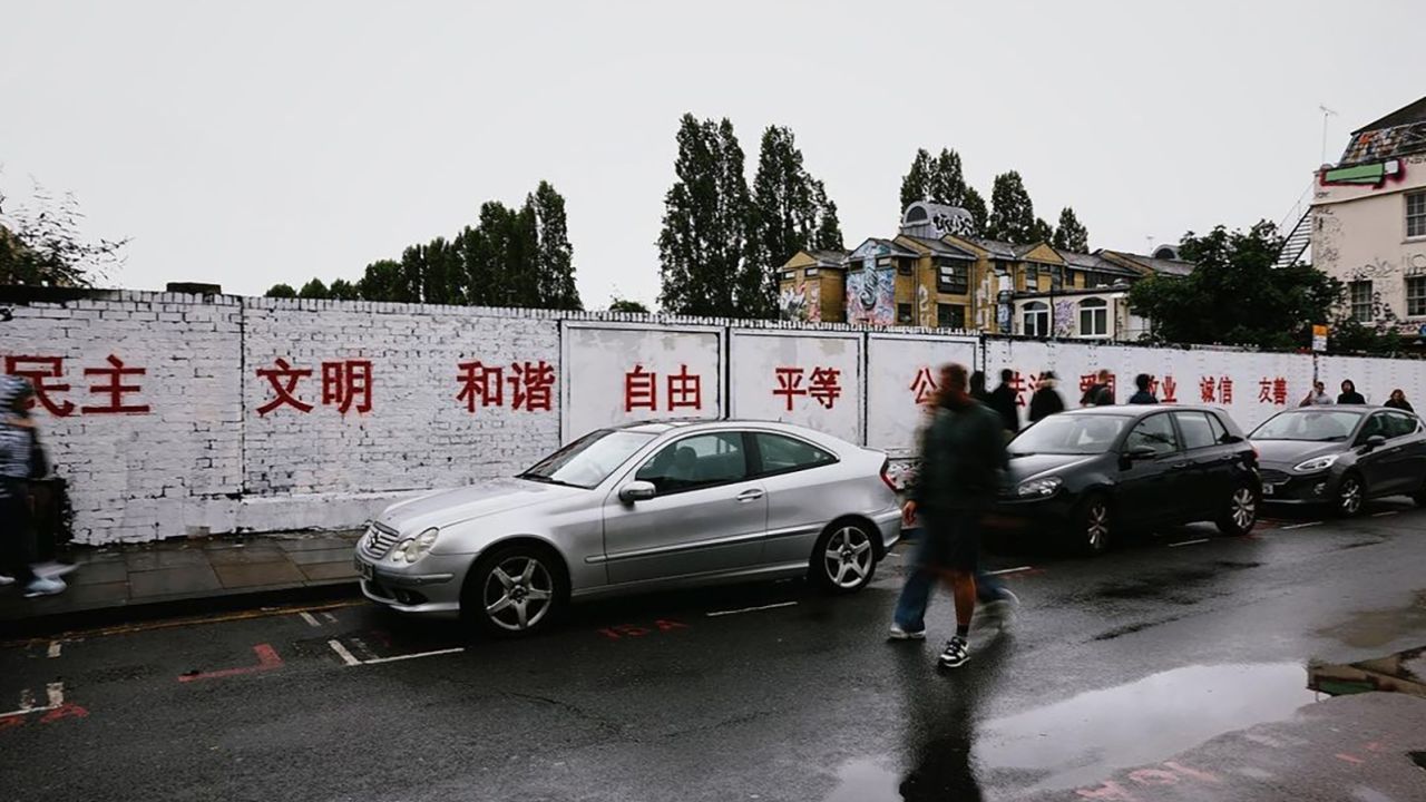 A grafitti wall in Brick Lane was whitewashed and painted over with red slogans promoting China's "core socialist values."