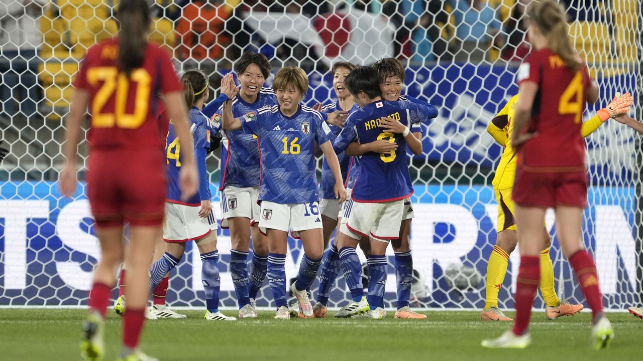 Japan players celebrate at the end of the team's dominant group stage victory over Spain at the Women's World Cup.