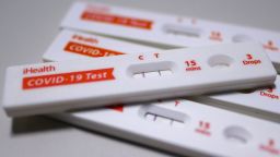 A pile of positive iHealth COVID-19 Antigen Rapid Tests is seen on July 20, 2023 in Houston, Texas. (Photo by Reginald Mathalone/NurPhoto via AP)