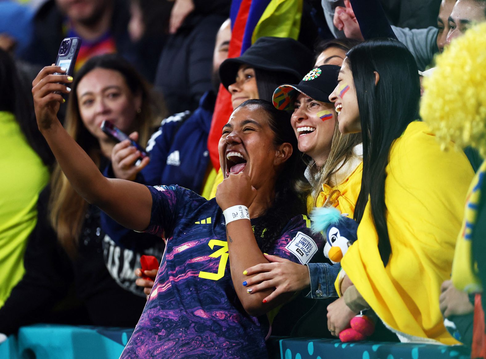 Colombia's Daniela Arias celebrates with fans on August 8 after her team defeated Jamaica 1-0 to progress to the quarterfinals.