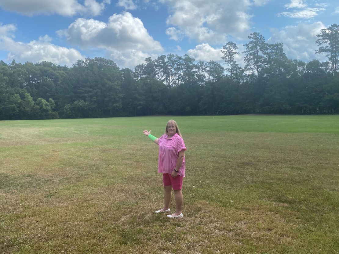 Peggy Jones stands at the 6-acre property where she was attacked July 25 by a hawk and snake.
