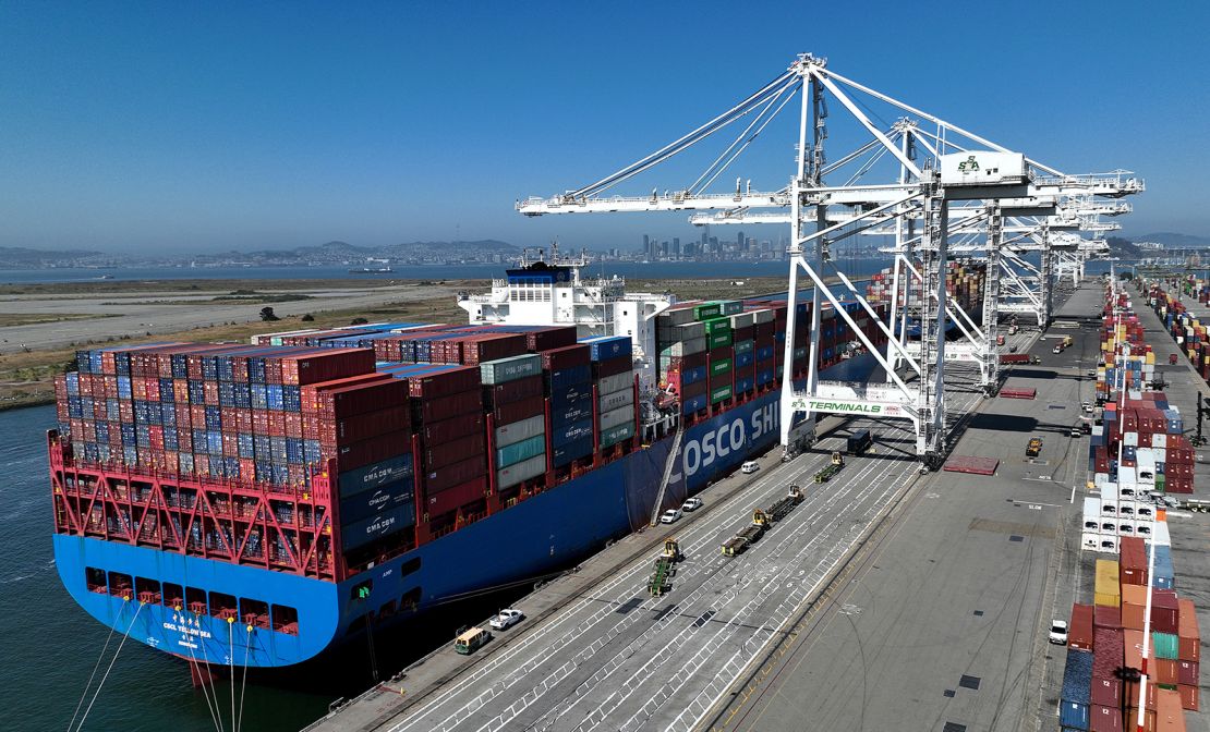 In an aerial view, a Chinese container ship sits docked at the Port of Oakland on August 07, 2023 in Oakland, California. 