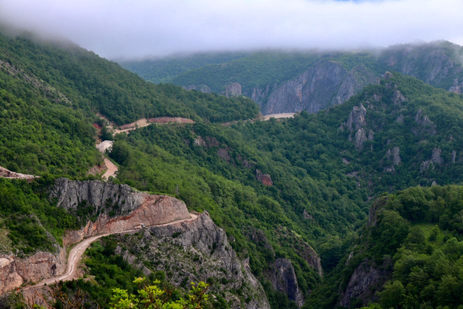 Scientists warn that hydropower plants could have a detrimental effect on the region's biodiversity. To enable construction of the Ulog dam, roads have been cut into the dense forest so that logging trucks and other vehicles can access the site.