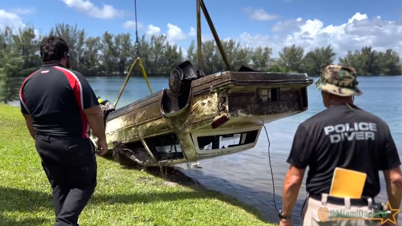 Divers were working Tuesday to recover vehicles from the Doral Lake with assistance from Miami-Dade Fire Rescue.