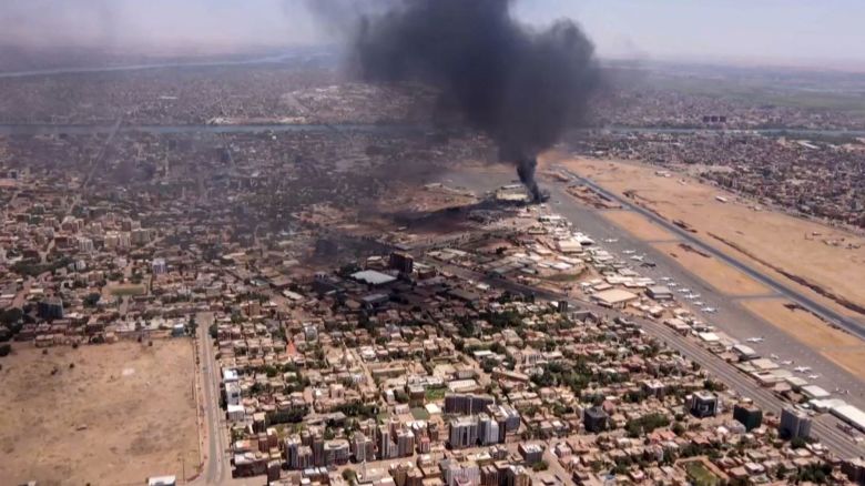 TOPSHOT - This image grab taken from AFPTV video footage on April 20, 2023, shows an aerial view of black smoke rising above the Khartoum International Airport amid ongoing battles between the forces of two rival generals. - Hundreds of people have been killed since the fighting erupted on April 15 between forces loyal to Sudan's army chief Abdel Fattah al-Burhan and his deputy, Mohamed Hamdan Daglo, who commands the paramilitary Rapid Support Forces (RSF). (Photo by AFP) (Photo by -/AFP via Getty Images)