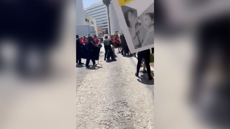 NextImg:Striking hotel workers file complaint over alleged violence on picket line | CNN Business