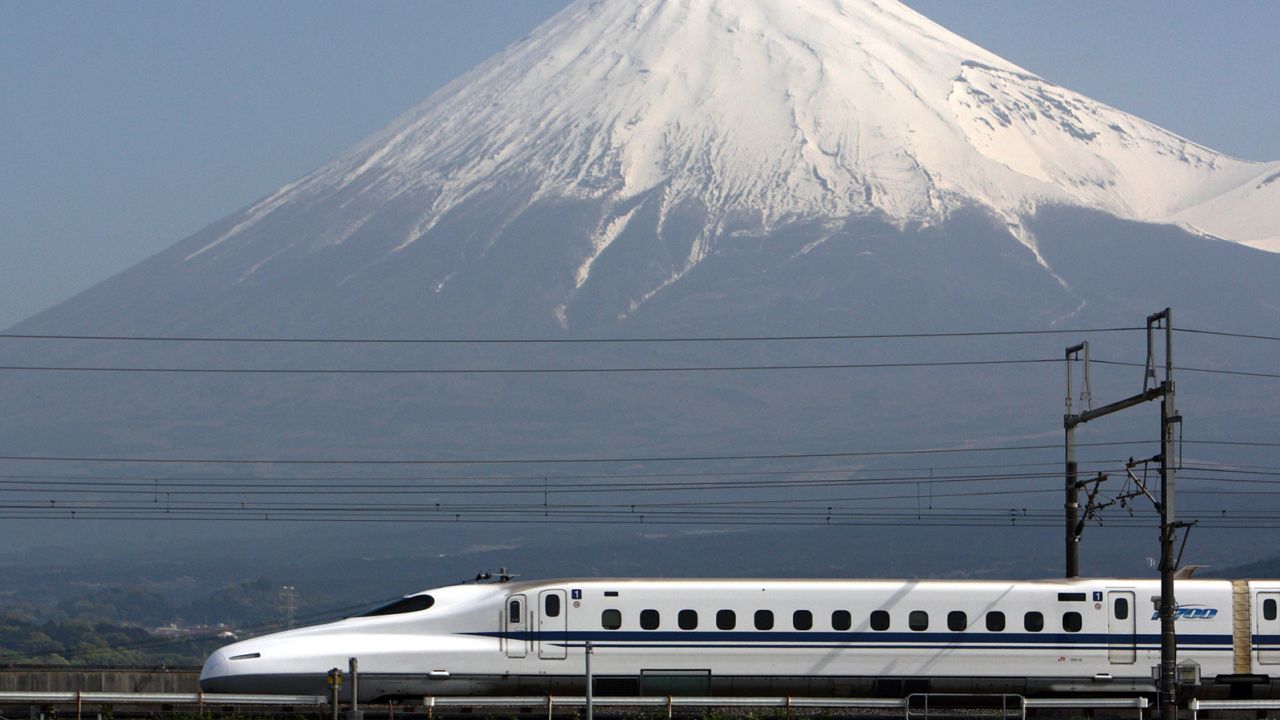 Central Japan Railway Co.'s N700 series Shinkansen bullet train travels past Mount Fuji, in Fuji City, Shizuoka Prefecture, Japan, on Friday, April 30, 2010.