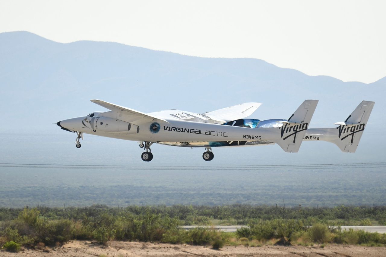 The Virgin Galactic SpaceShipTwo space plane Unity flies at Spaceport America, near Truth and Consequences, New Mexico on July 11, 2021  before travel to the cosmos. Billionaire Richard Branson takes off on July 11, 2021 from a base in New Mexico aboard a Virgin Galactic vessel bound for the edge of space, a voyage he hopes will lift the nascent space tourism industry off the ground.A massive carrier plane made a horizontal take-off from Space Port, New Mexico at around 8:40 am Mountain Time (1440 GMT) and will ascend for around an hour to an altitutude of 50,000 feet (15 kilometers). The mothership will then drop a rocket-powered spaceplane called VSS Unity, which will ignite its engine and ascend at Mach 3 beyond the 50 miles (80 kilometers) carrying two pilots and four passengers, including Branson. (Photo by Patrick T. FALLON / AFP) (Photo by PATRICK T. FALLON/AFP via Getty Images)