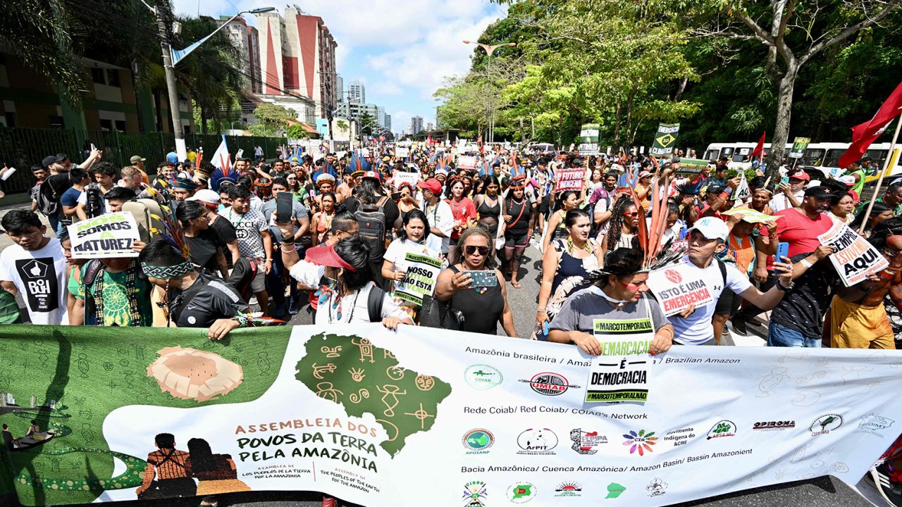 Indigenous people from Amazon countries and members of social movements take part in the March of the Peoples of the Earth for the Amazon in Belém, Para State, Brazil, on August 8.