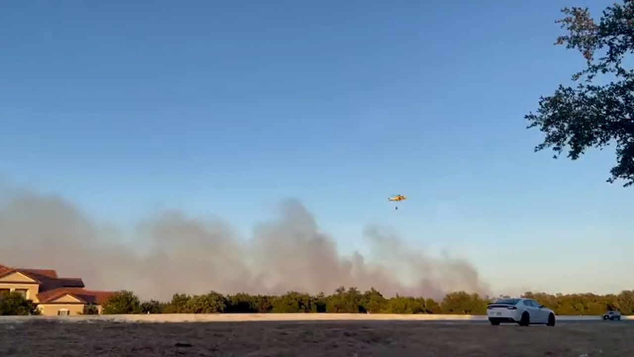 A large brush fire was actively burning in Cedar Park, Texas, on Tuesday