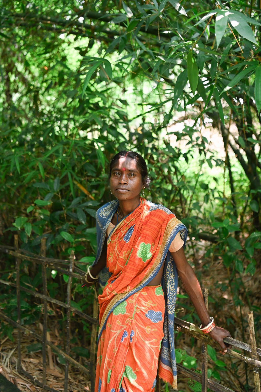 Gita Kumari Bhumik, photographed outside her home in Kalain region of Assam. Her family lost their home in the devastating floods in Assam last year. They now live in a home built with the relief housing unit (RHU) structure.