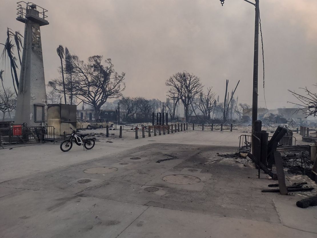 Destroyed buildings smolder after the wildfires in Lahaina.