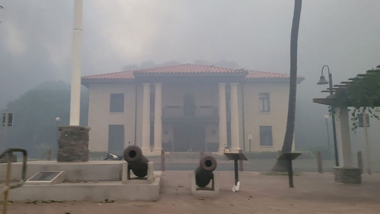 Smoke obscures the Old Lahaina Courthouse on Wednesday as wildfires destroy a large part of the historic town.