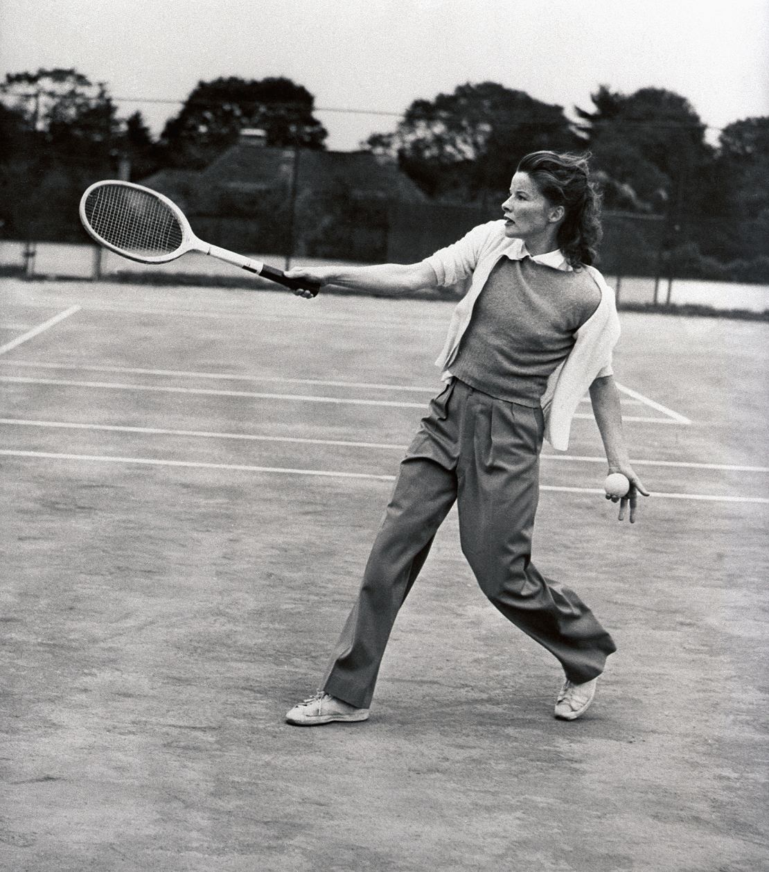 Katharine Hepburn plays a friendly game of tennis at the Merion Cricket Club.