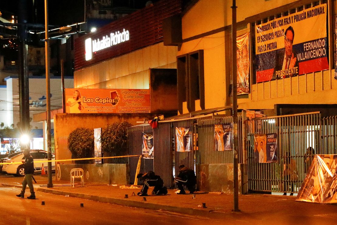 Security officials work at the rally site where Villavicencio was killed on Wednesday.