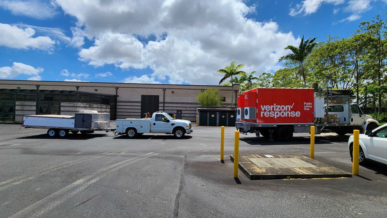 A Verizon mobile cell site on wheels waits to be loaded on a barge in O'ahu for transport to Maui 