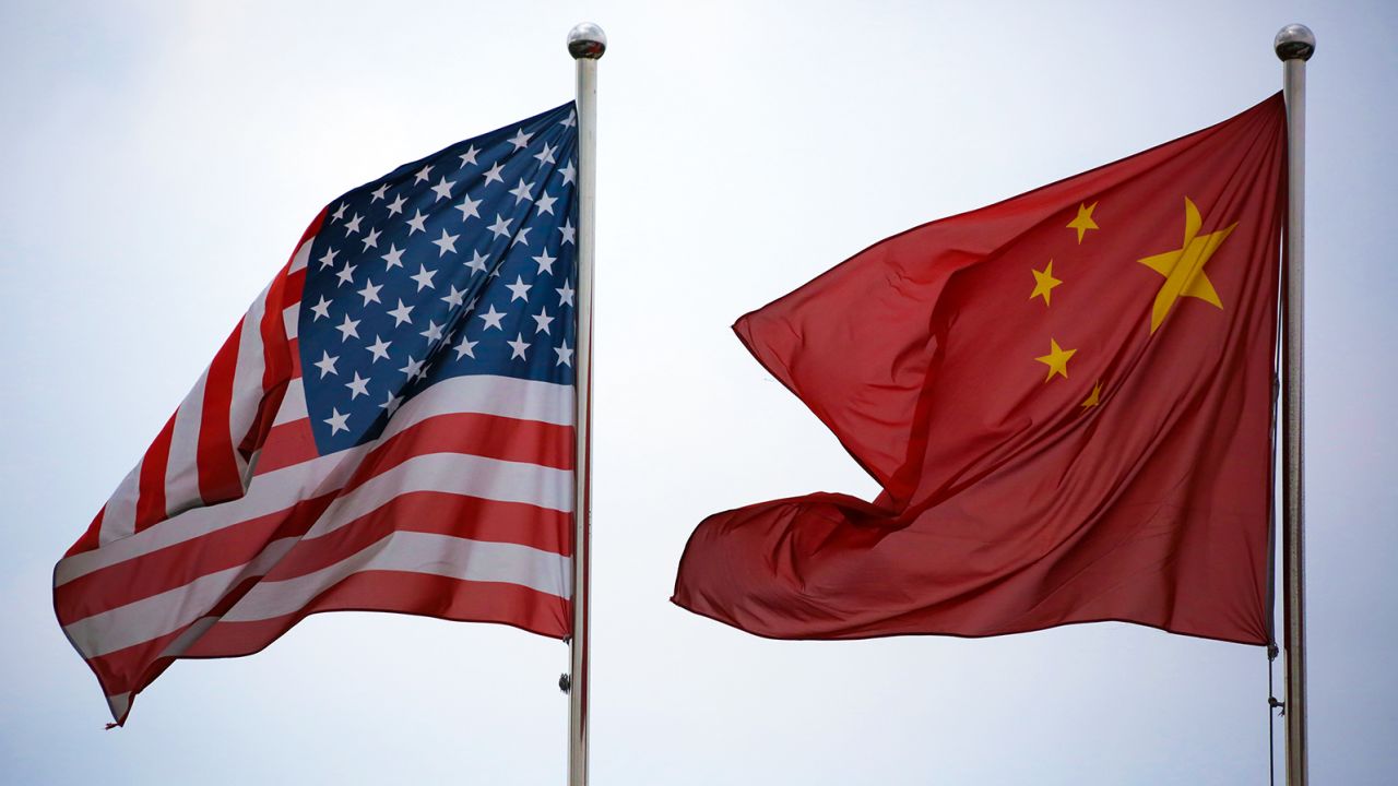 US and Chinese national flags flying outside a building in Shanghai in a file photo.